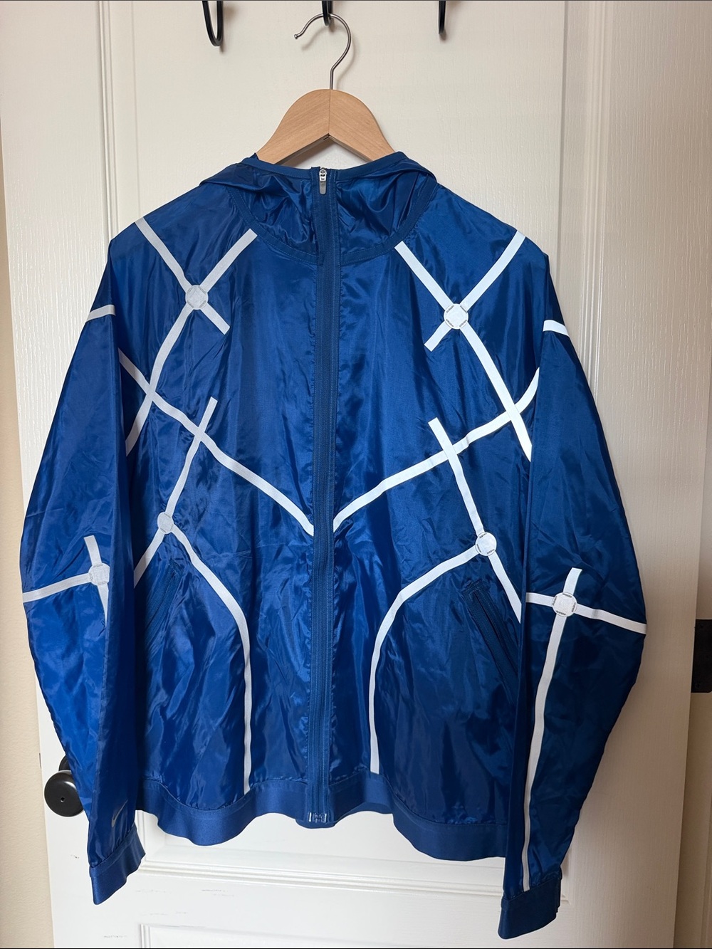 Nike Blue Windbreaker Jacket with White Geometric Reflective Accents